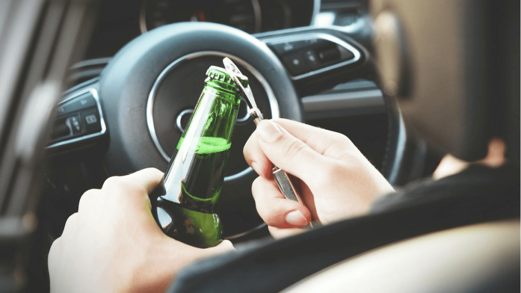 Drinking alcohol while driving.