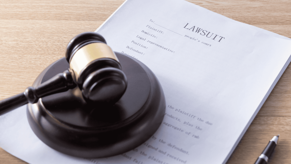 A gavel on top of a lawsuit file.