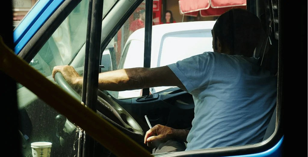 Truck driver holding a joint.