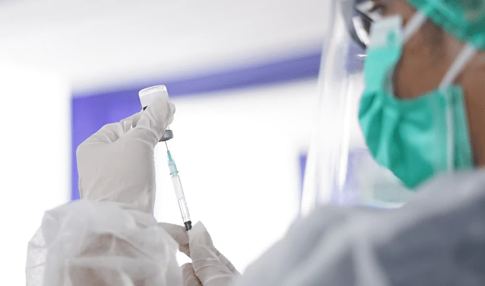 Medical staff preparing an injection.
