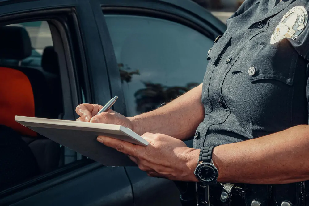 Officer writing a police report.