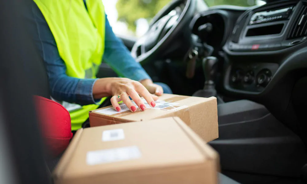 Delivery truck driver in their truck.