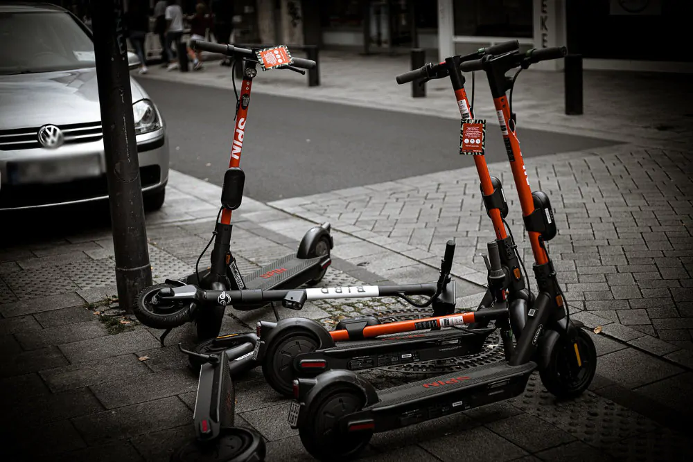 Parked e-scooters.